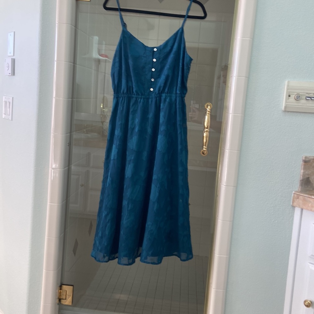Teal dress with floral pattern by Lauren Conrad